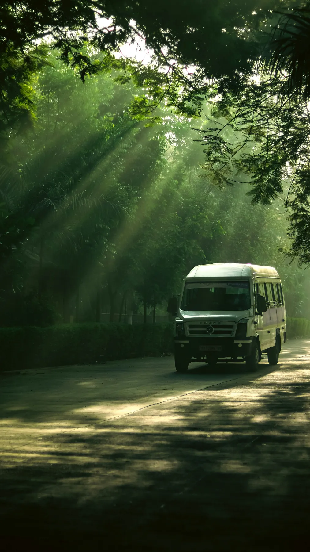Representative Tempo Traveller style van on an Indian road